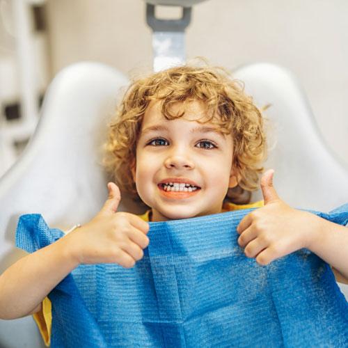 Happy child in dental chair at Ridgeview Dental Group, Menomonee Falls, WI